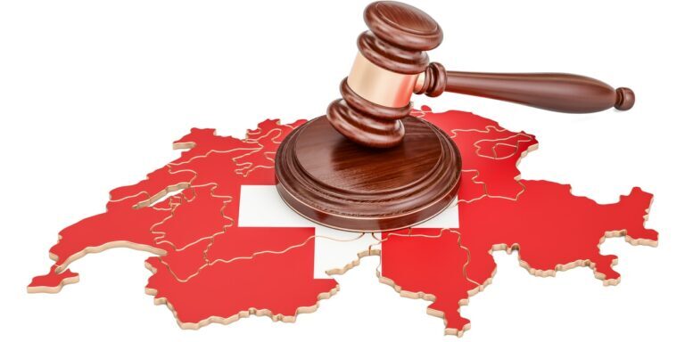Wooden Gavel on map of Switzerland, 3D rendering isolated on white background